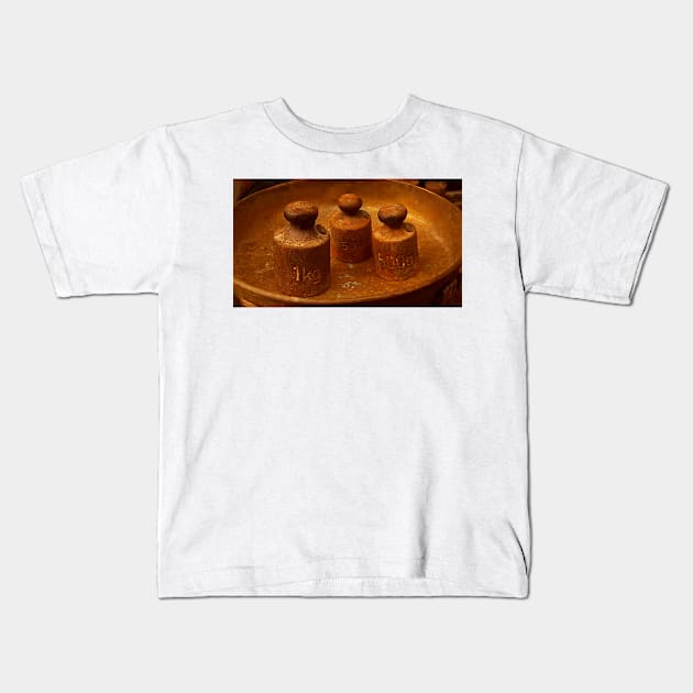 WEIGHTS in a SCALE Pan Kids T-Shirt by mister-john